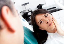 woman in pain at dentist office needs root canal Gaithersburg, MD